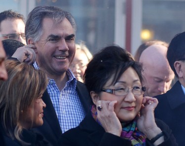 Premier Jim Prentice plugs his ears as the fireworks go off during Chinese New Year celebrations at the Chinese Cultural Centre on February 15, 2015.