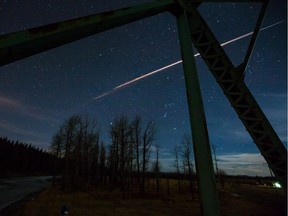 A fireball streaks across the sky just west of Calgary on Monday, Feb. 23, 2015. A Calgary photographer who captured a fireball streaking across the night sky says he thought he'd witnessed a plane crashing or a meteor breaking up.