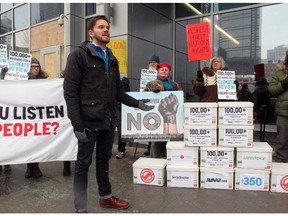 The Council of Canadians and Greenpeace along with local Calgarian activists deliver over 100,000 messages calling the the National Energy Board to review the climate impacts of the Energy East pipeline, in Calgary on February 2, 2015.