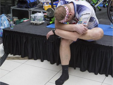 Ben Ritman, stretches his legs between races at the CANSuffer to Conquer event, in which participants ride for up to 24 consecutive hours to raise money for the fight against cancer at the Southcentre Mall in Calgary, on February 28, 2015.