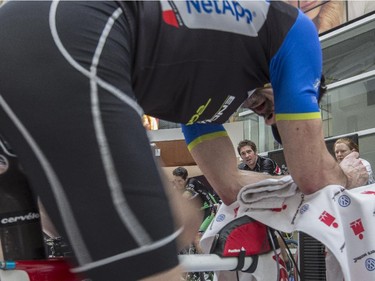 Shawn Gibbs, right, Mike Beauchamp, middle, Martin Dodd, left, and Myles Gualin, front, during the CANSuffer to Conquer event, in which participants ride for up to 24 consecutive hours to raise money for the fight against cancer at the Southcentre Mall in Calgary, on February 28, 2015.