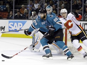Calgary Flames forward Mikael Backlund chases San Jose's Brent Burns during Monday's game.