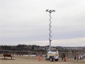 Cameras are up to monitor the fence construction project on the park ridge overlooking the Elbow River on Britannia Drive in Calgary on Feb.18, 2015.