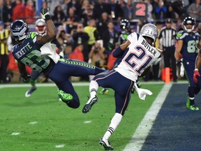Malcolm Butler (R) of the New England Patriots intercepts a pass intended for Ricardo Lockette (L) of the Seattle Seahawks late in the fourth quarter of Super Bowl XLIX  on February 1, 2015 at University of Phoenix Stadium in Glendale, Arizona. The New England Patriots defeated the Seattle Seahawks 28-24.       AFP PHOTO /  TIMOTHY  A. CLARYTIMOTHY A. CLARY/AFP/Getty Images