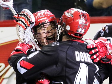 Calgary Roughneck Jeff Shattler, left, celebrates scoring the tying goal in the final seconds to send the game into overtime  against the Buffalo Bandits during National Lacrosse League action at the Scotiabank Saddledome on Saturday Feb. 7, 2015. The Roughnecks ended up loosing 15-14.