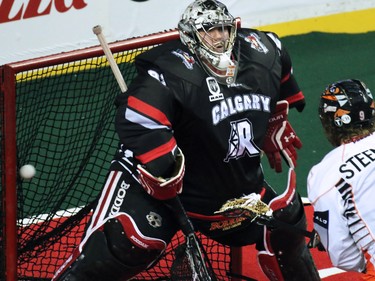 The Buffalo Bandits' Mark Steenhuis puts a shot past the Calgary Roughnecks' Frankie Scigliano during National Lacrosse League action at the Scotiabank Saddledome on Saturday Feb. 7, 2015.