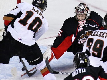 Calgary Hitmen Chase Lang couldn't quite get the puck by Prince George Cougars goaltender Ty Edmonds during first period of WHL action at the Scotiabank Saddledome on Wednesday February 11, 2015.