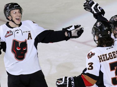 The Calgary Hitmen celebrate Kenton Helgesen's goal against the Prince George Cougars during second period WHL action at the Scotiabank Saddledome on Wednesday February 11, 2015.