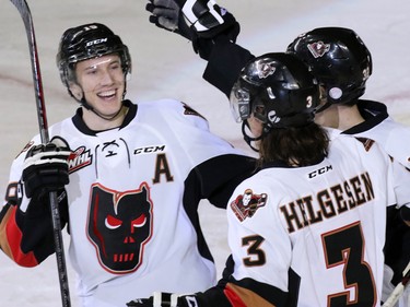 The Calgary Hitmen celebrate Kenton Helgesen's goal against the Prince George Cougars during second period WHL action at the Scotiabank Saddledome on Wednesday February 11, 2015.