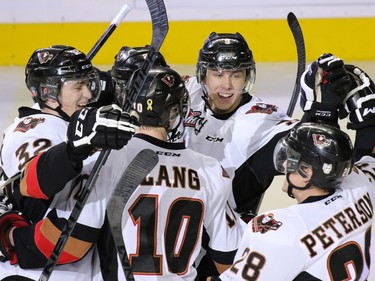 The Calgary Hitmen celebrate Travis Sanheim's goal against the Prince George Cougars during second period WHL action at the Scotiabank Saddledome on Wednesday February 11, 2015.