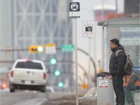 CALGARY, AB.; FEBRUARY 18, 2015  -- Riders wait for a downtown bus on Centre Street at 22nd Avenue NW Wednesday February 18, 2015. (Ted Rhodes/Calgary Herald) For City  story by Jason Markusoff. Trax # 00062753A