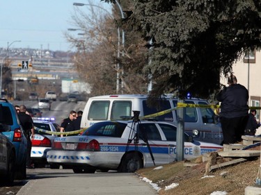 Calgary police investigate after a fatal shooting in the 400 block of 26th Avenue N.E. on Sunday, February 22, 2015.