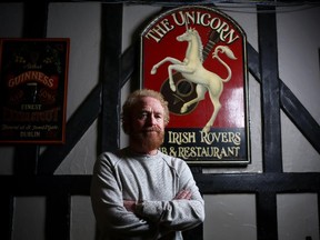 George Millar from the Irish Rovers poses in the Unicorn Pub which he and his bandmates opened decades ago in Calgary.