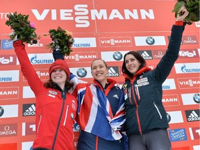 Calgary's Elisabeth Vathje, left, poses on the Feb. 7 podium with United Kingdom's winner Lizzy Yarnold, centre, and Austria's third placed Janine Flock. Her silver in Innsbruck, Austria was one of four World Cup medals she's accumulated this season.