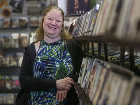 Sheryl Guillaume stands in an aisle of her video rental shop Casablanca, which is at risk of shutting down if business doesn't pick up, in Calgary, on February 19, 2015. --