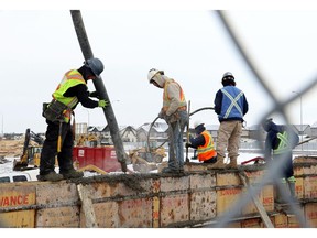 A cribbing construction crew works on the foundation of a new condo complex in Calgary.