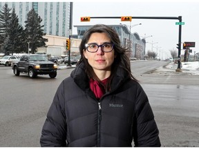 Nemea Beskas, owner of Oak and Vine, stands at the intersection of 16th Avenue and 10th Street N.W. on February 11, 2015. For the fourth year in a row, the speed-on-green camera at that intersection is the busiest one in the city, with 27,424 tickets issued to drivers.