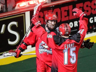Calgary Roughnecks players forward Curtis Dickson, left, and forward Shawn Evans celebrated after Dickson scored against the Vancouver Stealth during first half National Lacrosse League action at the Scotiabank Saddledome on February 21, 2015.