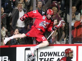 Calgary Roughnecks forward Curtis Dickson launched himself against the boards after scoring one of his seven goals on the night against the Vancouver Stealth on Saturday.