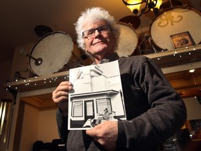 Bob Everett, the former owner of Eamon's Camp, held one of his photos of the property on February 21, 2015. Everett is fighting to have the historic building returned to the original site.
