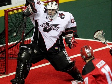 Calgary Roughnecks forward Curtis Dickson unleashed a shot which snuck past Vancouver Stealth goalie Tyler Richards during first half National Lacrosse League action at the Scotiabank Saddledome on February 21, 2015.