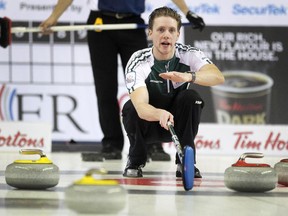 P.E.I. skip Adam Casey yelled to his sweepers during the afternoon pre qualifier game between Nova Scotia and PEI to earn the final spot into the Tim Hortons Brier in Calgary on February 27, 2015.