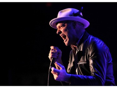 Tragically Hip lead singer Gordon Downie and members of the Canadian rock bank performed to a packed crowd at the Scotiabank Saddledome on February 9, 2015.