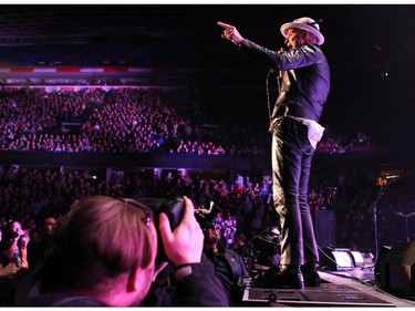 Tragically Hip lead singer Gordon Downie and members of the Canadian rock bank performed to a packed crowd at the Scotiabank Saddledome on February 9, 2015.