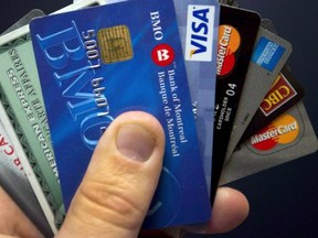 Credit cards are displayed in Montreal on December 12, 2012.