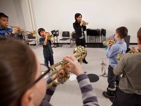 Local trumpeter Natalie DeJong puts her students through some scales.