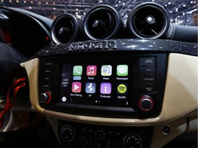 Apple Inc.'s CarPlay system is seen in the touchscreen console of a Ferrari FF automobile.