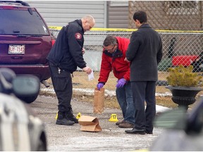 Investigators collected evidence at the scene of a serious overnight stabbing in the 3000 block of 30A Street SE on February 20, 2015.