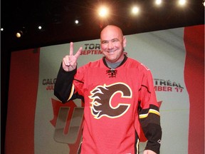 Dana White, president of Ultimate Fighting Championship, acknowledges the cheering crowd after announcing that the city will play host to a UFC event during a press conference Wednesday March 21, 2012 at Flames Central.