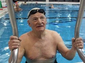 Philanthropist Jim Gray climbs out of the Eau Claire YMCA pool on Thursday, Feb. 26, 2015 on the penultimate day of his 23-year, 300,000 plus length, swimming marathon. The Eau Claire Y is to be named the Gray Family Eau Claire YMCA in his honour.
