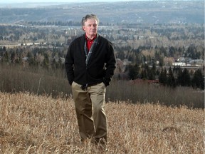 Calgary realtor Gary MacLean looks out over northwest Calgary neighbourhoods from Edgemont Monday February 16, 2015. He is predicting a decline in city home prices over the next few months.