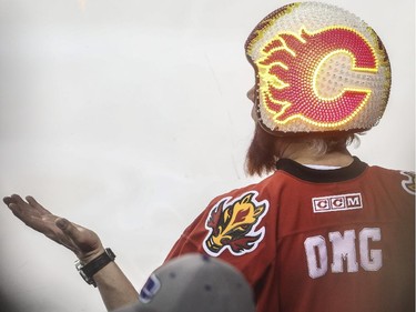 OMG is right. What happened in the third tonight? A Flames fan wears a light up Flames motorcycle helmut during game action against the Anaheim Ducks at the Saddledome in Calgary, on February 20, 2015.