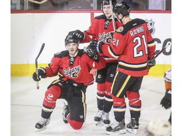 Lance Bouma celebrates from his knees after scoring the second goal of the game against the Anaheim Ducks at the Saddledome in Calgary, on February 20, 2015.