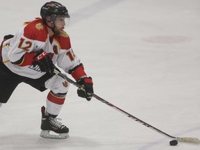 U of C Dinos forward Colton Grant and his mates will go against the cross-town rival MRU Cougars in a best-of-three Canada West semifinal playoff series this weekend.