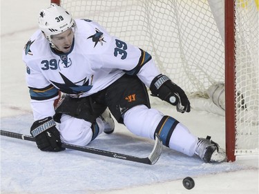 San Jose Sharks' Logan Couture plays net after the goalie is pulled and the Flames put the pressure on during NHL action at the Saddledome in Calgary, on February 4, 2015.