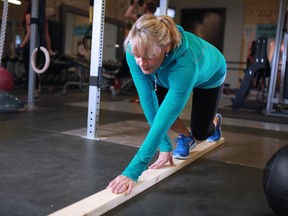 Fitness instructor Helen Vanderburg demonstrates a mobility and stability training exercise