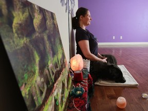 Yoga instructor Johanna Steinfeld demonstrates a meditation pose for her February 2015 yoga column.