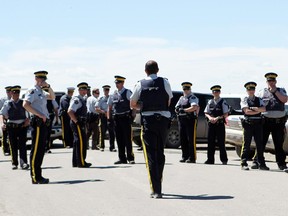 Evacuees confronted the RCMP on the northwest corner of town in a bid to enter the Town of High River on Thursday, June 27th 2013.