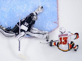 Calgary Flames winger Johnny Gaudreau, right, tries to get a shot in on Los Angeles Kings goalie Jonathan Quick during a Dec. 22 meeting between the teams.