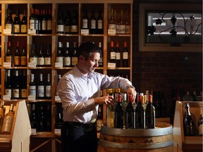 Darren Stewart, co-owner of Vine Styles, is wary of new rules that toughen up the distance that separates between liquor stores.