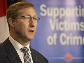 Federal Justice Minister Peter Mackay at the Calgary police headquarters on Feb. 12, 2015.