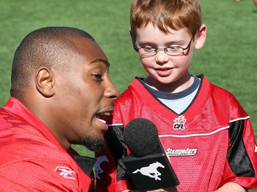 Stampeders' Nik Lewis is taped while being interviewed by Bailey Marsden, 9, a Kid Correspondent during the 2009 season.