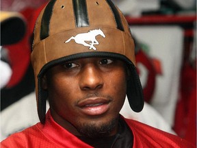 Stampeders receiver Nik Lewis sports a spiffy hat in the dressing room following an August 2008 practice.