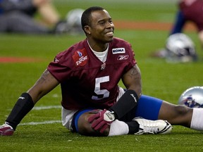 Kahlil Carter, seen laughing with Montreal Alouettes teammates in 2008, is the new defensive backs coach of the Calgary Stampeders.
