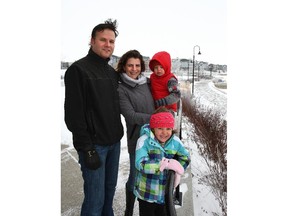 Chris and Yuliana Schaffer with kids Nicholas and Claudia look out on the lake in Chestermere.