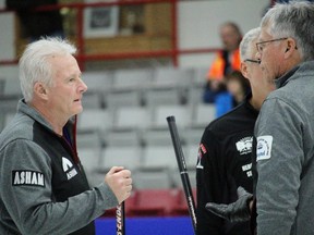 Frank Morissette, left, whose only previous Brier appearance came in 1976 with Wayne Sokolosky's Calgary Curling Club team, discusses a shot with Al Hackner on the weekend. The 64-year-old former Calgarian nearly qualified for Briers 39 years apart as Hackner's team was narrowly beaten in the Northern Ontario final by Brad Jacobs.